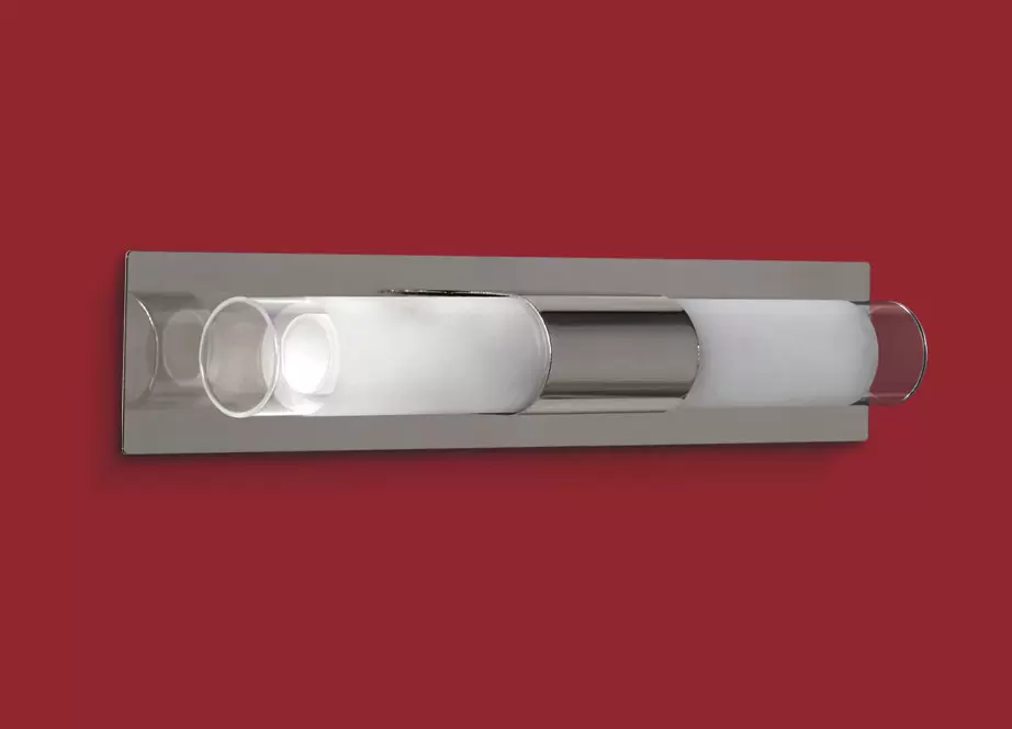 El aplique Punto Doble es un artefacto de aplicar fabricado en metal de estilo moderno de dos luces. Está disponible en color cromo o blanco.