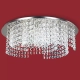 El plafón Alessandra Circular es una lámpara de cuatro luces apto LED, disponible en color acero con decoración de strass.
