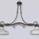 El balancín Viena es un colgante de dos luces apto LED, estilo vintage, disponible en color cobre patinado. Adaptable a todo tipo de ambiente