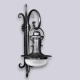 El aplique Farol Alumbrado es un aplique de una luz, estilo vintage, disponible en color acero. Apto para exterior e interior.