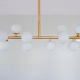 Colgante T. Luminaria moderna fabricada íntegramente en metal de 16 luces, disponible en cinco colores: negro, blanco, cobre, bronce o níquel.
